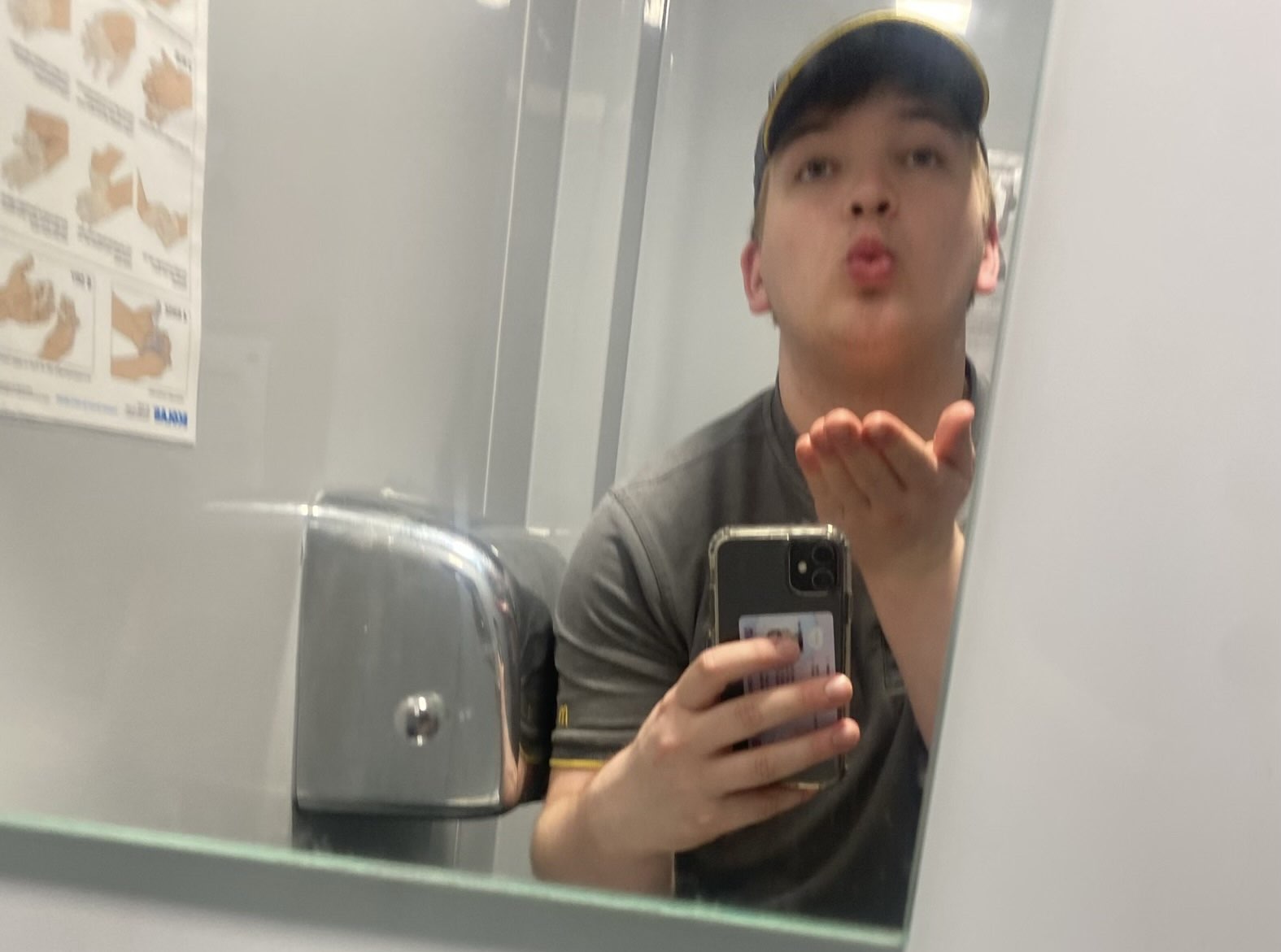 McFarlane, the reviewer, blowing a kiss in a uniform